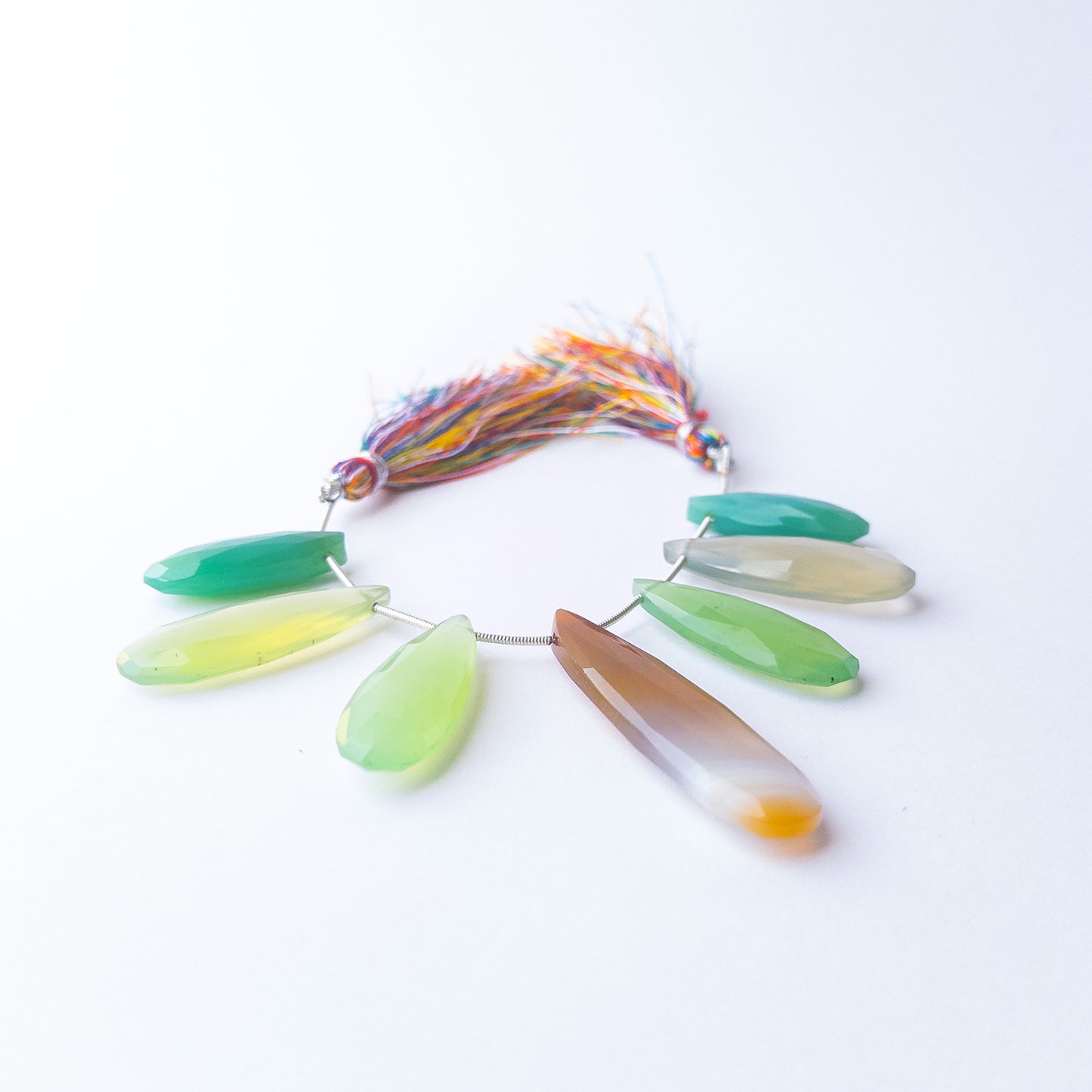 Chalcedony faceted briolettes displaying shimmering facets and premium craftsmanship in each piece.