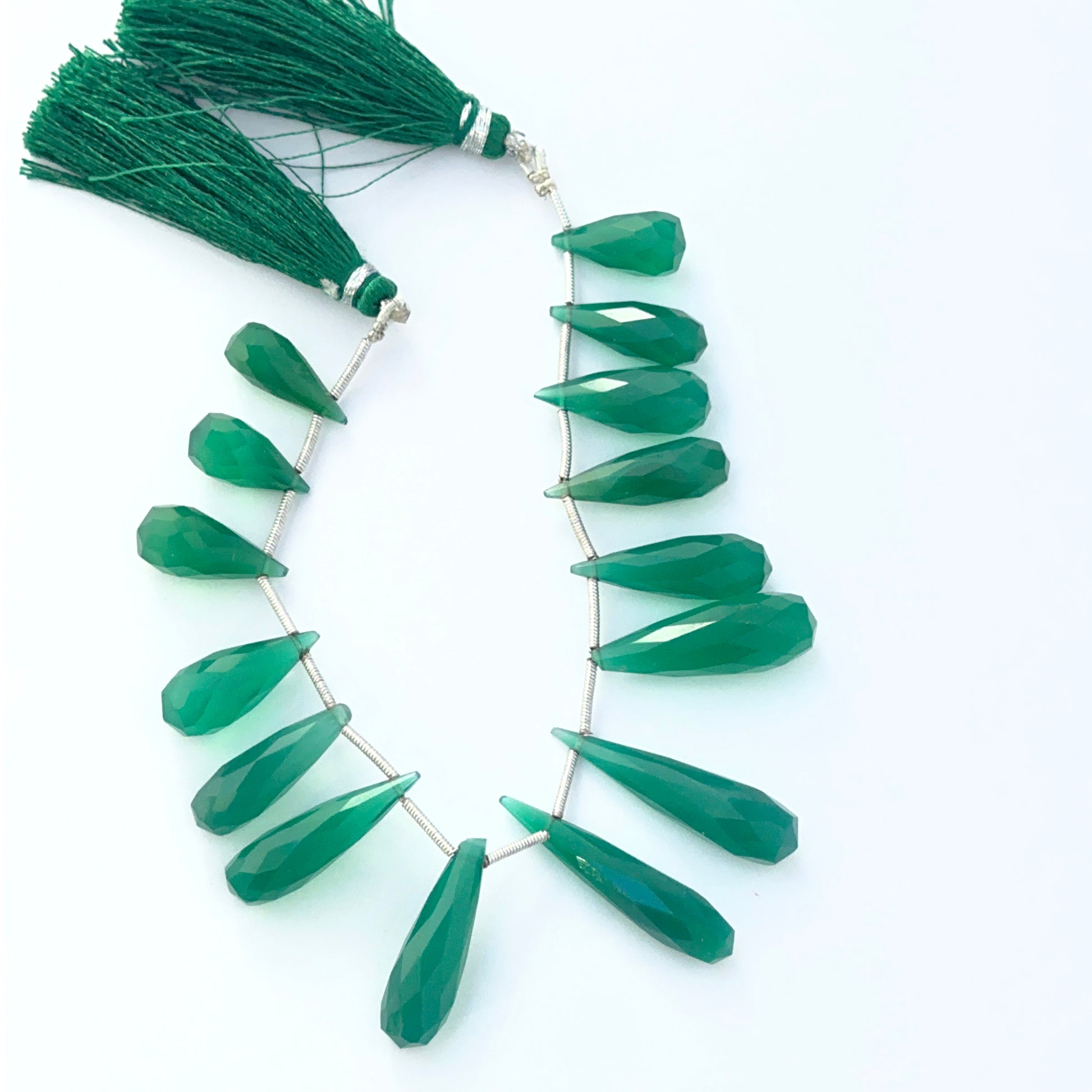 Hand‑selected green Chalcedony gemstone beads with crisp faceting and elegant elongated shapes.
