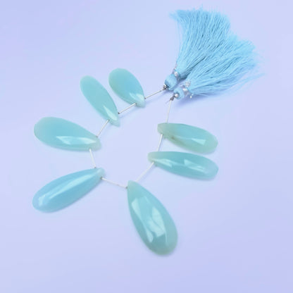 Chalcedony gemstone beads for jewellery making displayed with soft lighting.