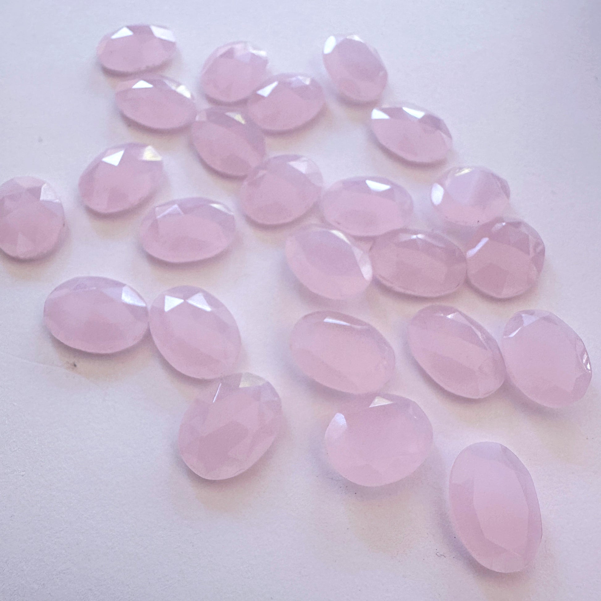 High-quality Chalcedony loose stones with faceted oval shape and smooth surface.