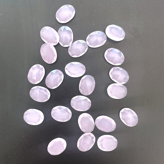 Chalcedony faceted ovals with shimmering finish and consistent sizing across 24 loose undrilled pieces.