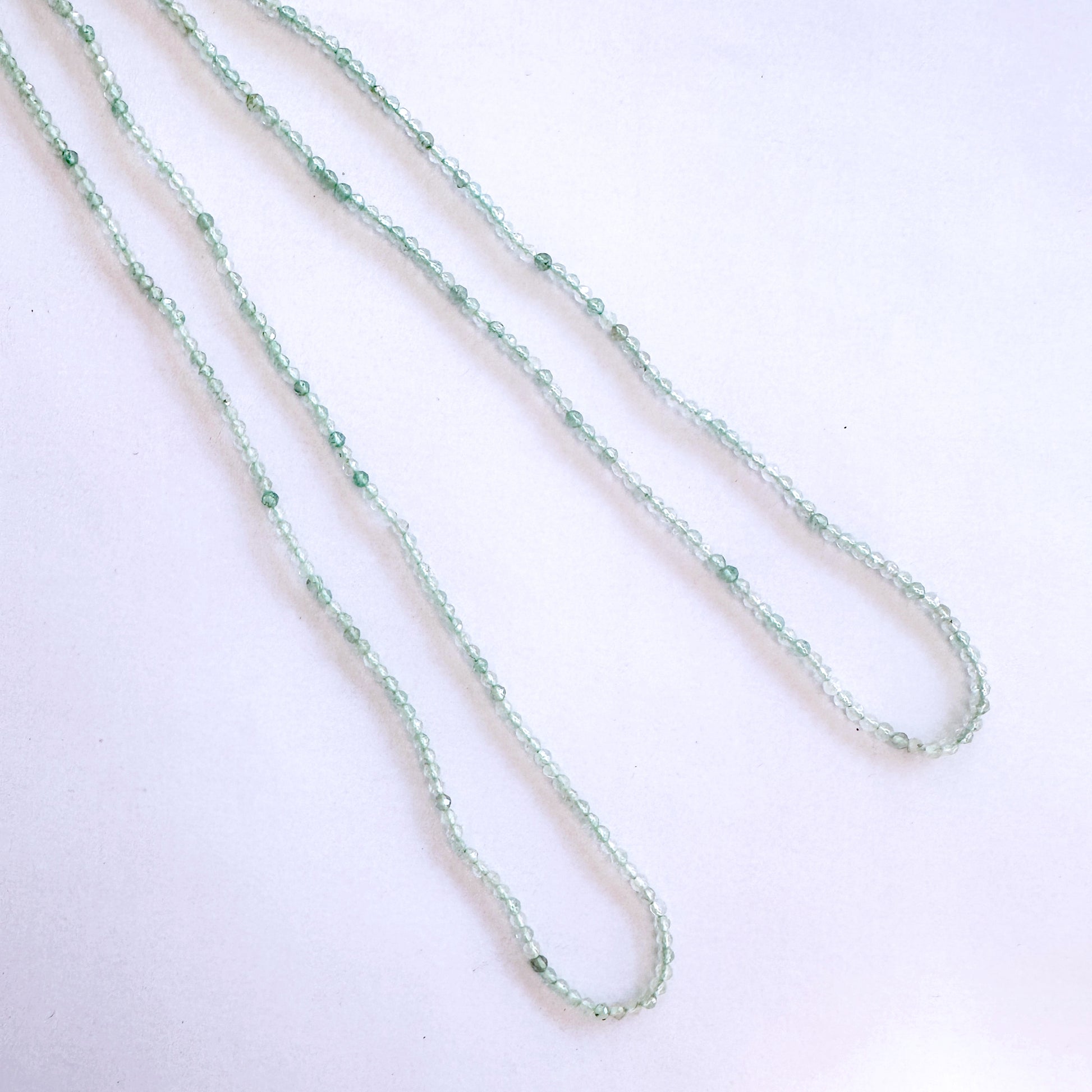 Chalcedony faceted rondelle beads in 2.1-2.3mm size, 32cm strand with soft green tones and delicate sparkle for elegant jewellery designs.