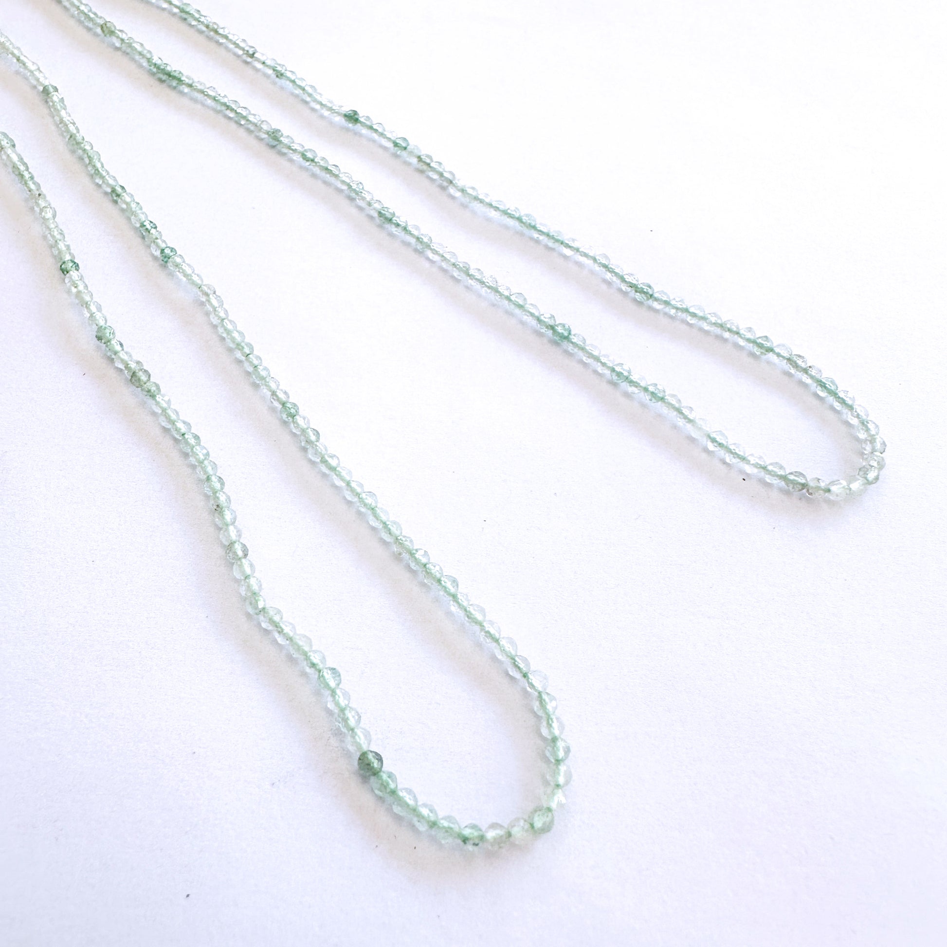 Faceted Chalcedony beads arranged in a 32cm strand with consistent 2.1-2.3mm sizing