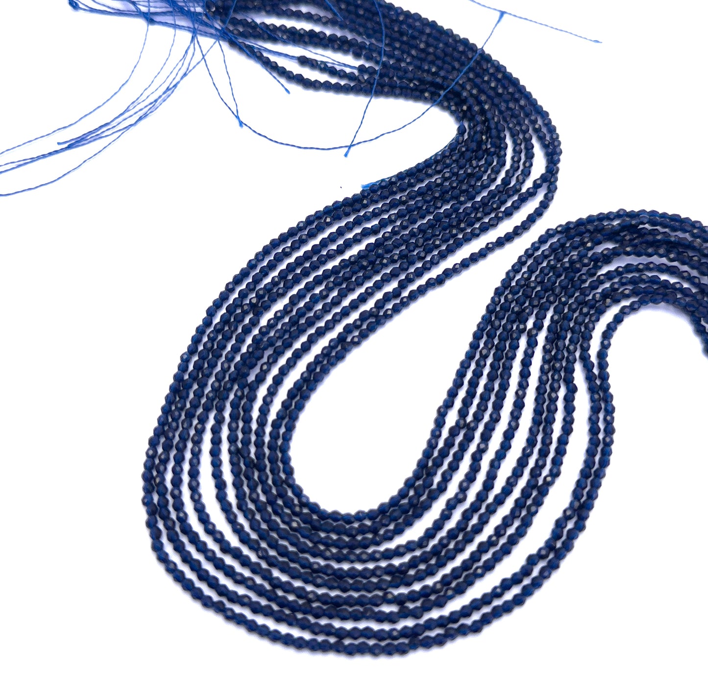 Natural Chalcedony stone beads arranged in strands with uniform size and shine.