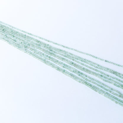 Handmade jewellery components featuring natural chalcedony faceted rondelle beads in a neatly aligned strand.