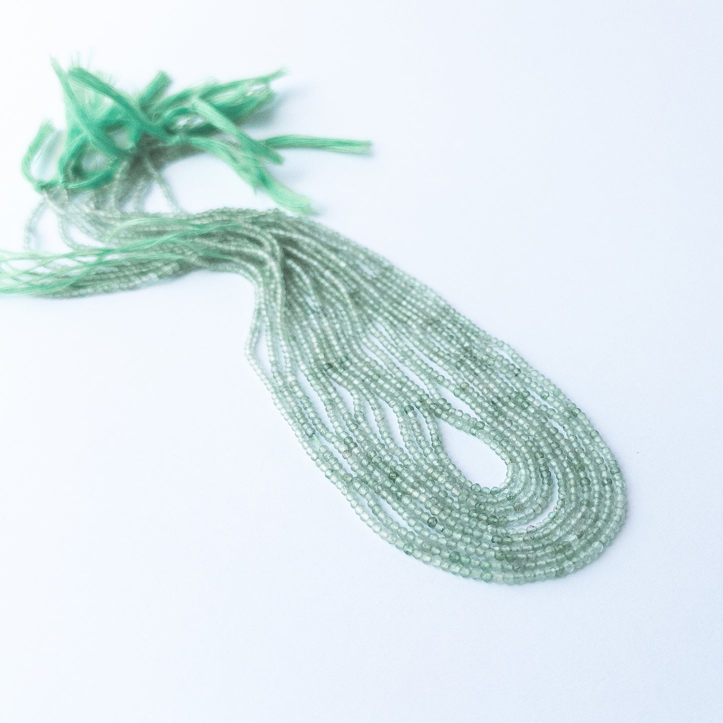 Chalcedony faceted rondelle gemstone beads in 2mm size arranged on a 31cm strand for handmade jewellery designs.
