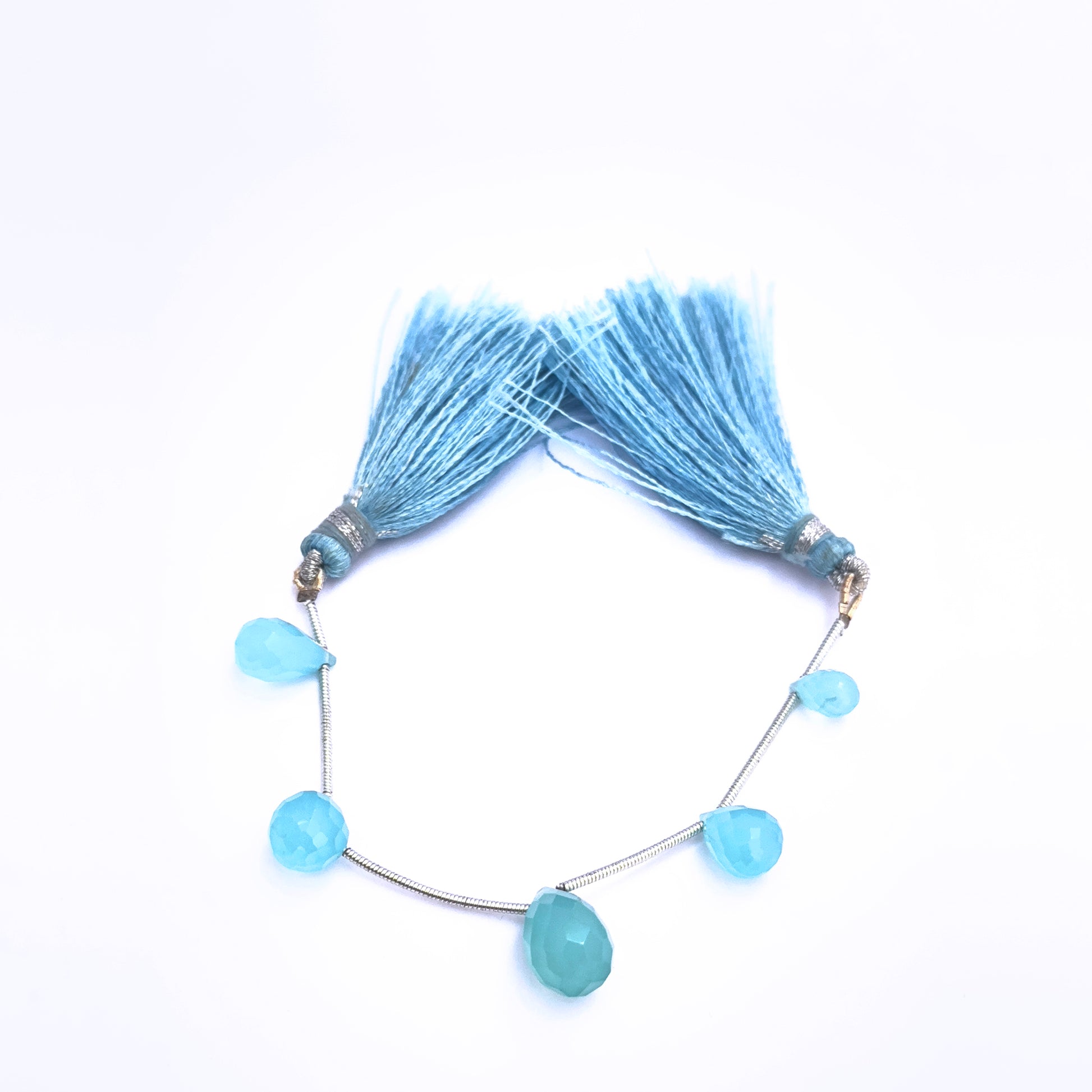 Natural Chalcedony stone beads arranged in a set of 5 with faceted finish.