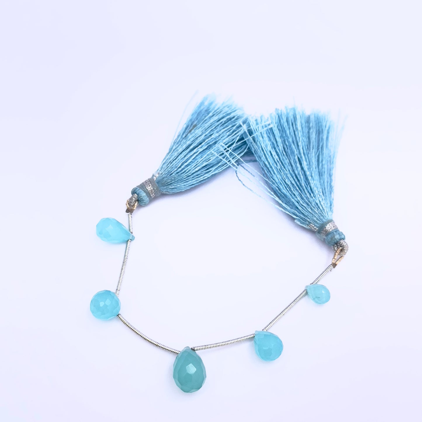 Handmade jewellery components featuring Chalcedony faceted teardrop beads.