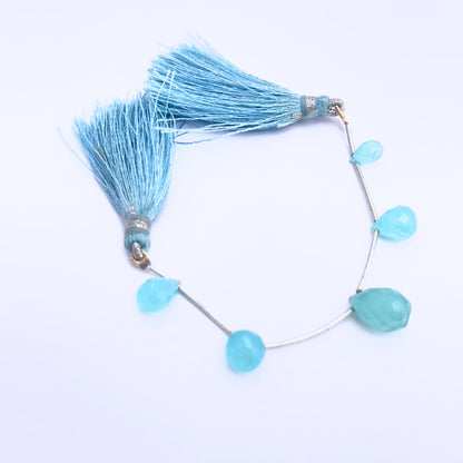 Chalcedony gemstone beads for jewellery making displayed with soft lighting.