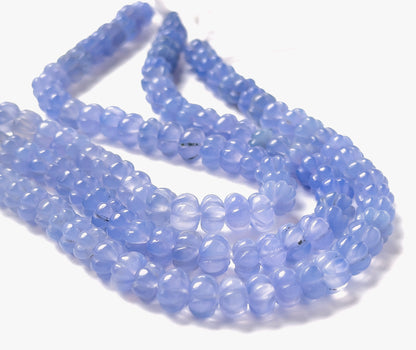 Chalcedony pumpkin‑cut beads sized 7.5–8mm arranged in a 20cm strand, showing soft translucent tones and the signature ridged pumpkin shape.