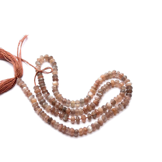 Close‑up of Chocolate Moonstone stone beads in faceted rondelle cut, highlighting soft glow for handmade jewellery components.