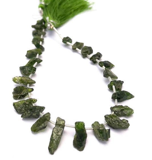 Close-up of Chrome Diopside gemstone beads showing raw texture and natural finish.