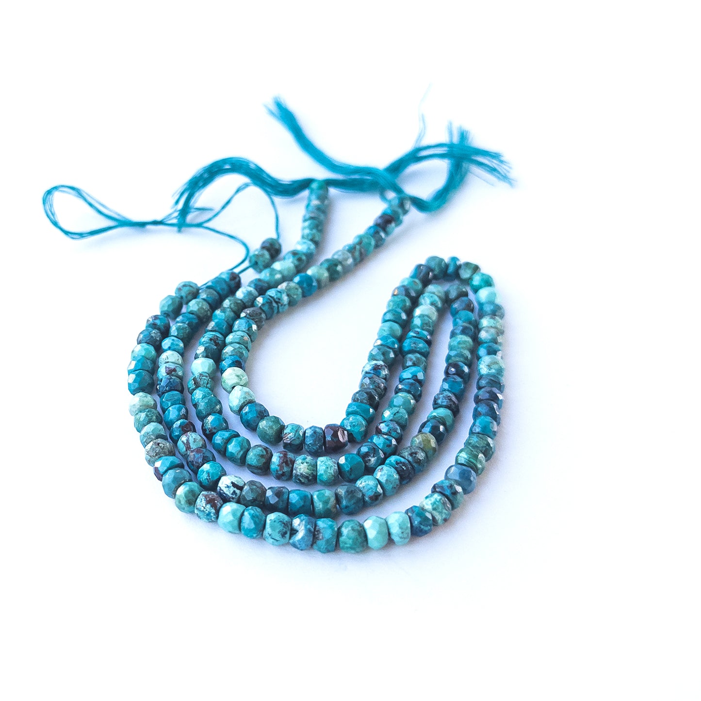Authentic Chrysocolla gemstone beads showcasing vivid blue‑green colour and polished rondelle shaping.