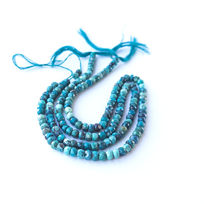 Authentic Chrysocolla gemstone beads showcasing vivid blue‑green colour and polished rondelle shaping.