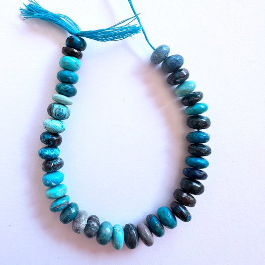 Chrysocolla smooth rondelle beads in 8.5mm size with polished surface and vibrant green-blue tones.