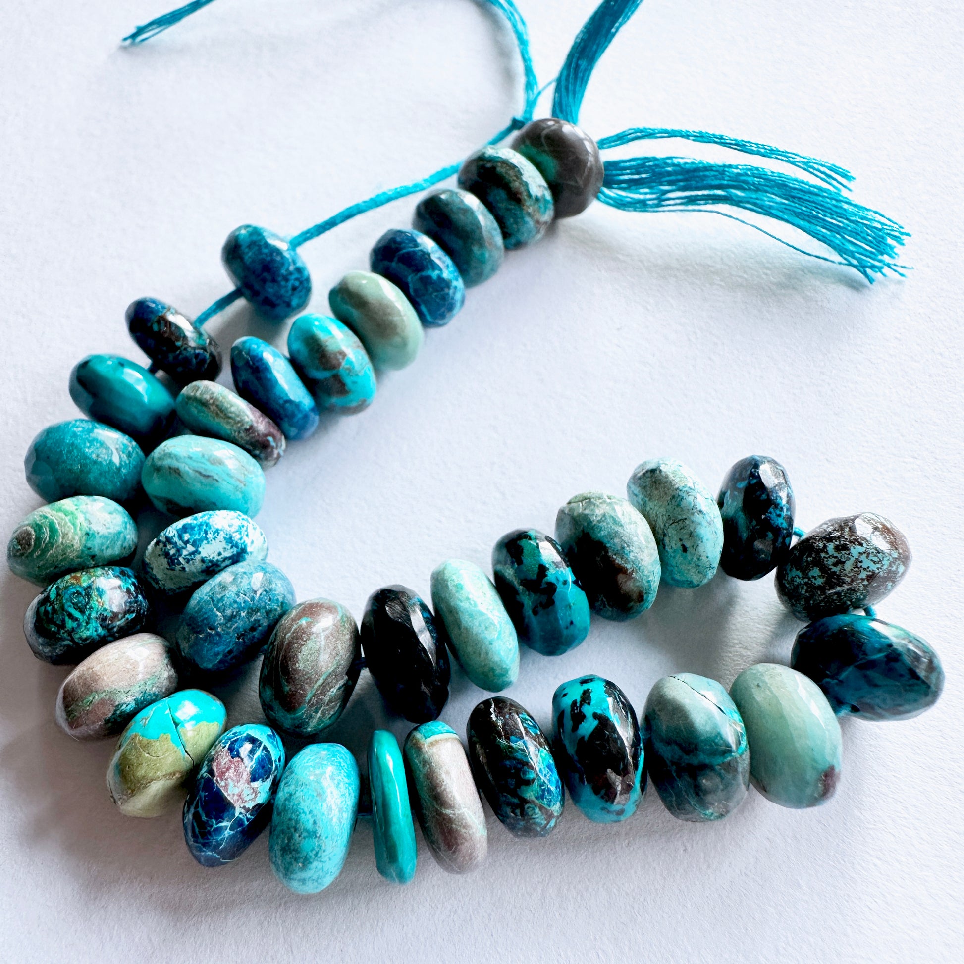 Natural gemstone beads for DIY jewellery featuring Chrysocolla in vibrant blue with consistent rondelle cut.