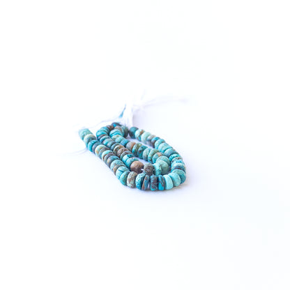 Chrysocolla smooth rondelles displaying natural colour variation and premium bead craftsmanship.