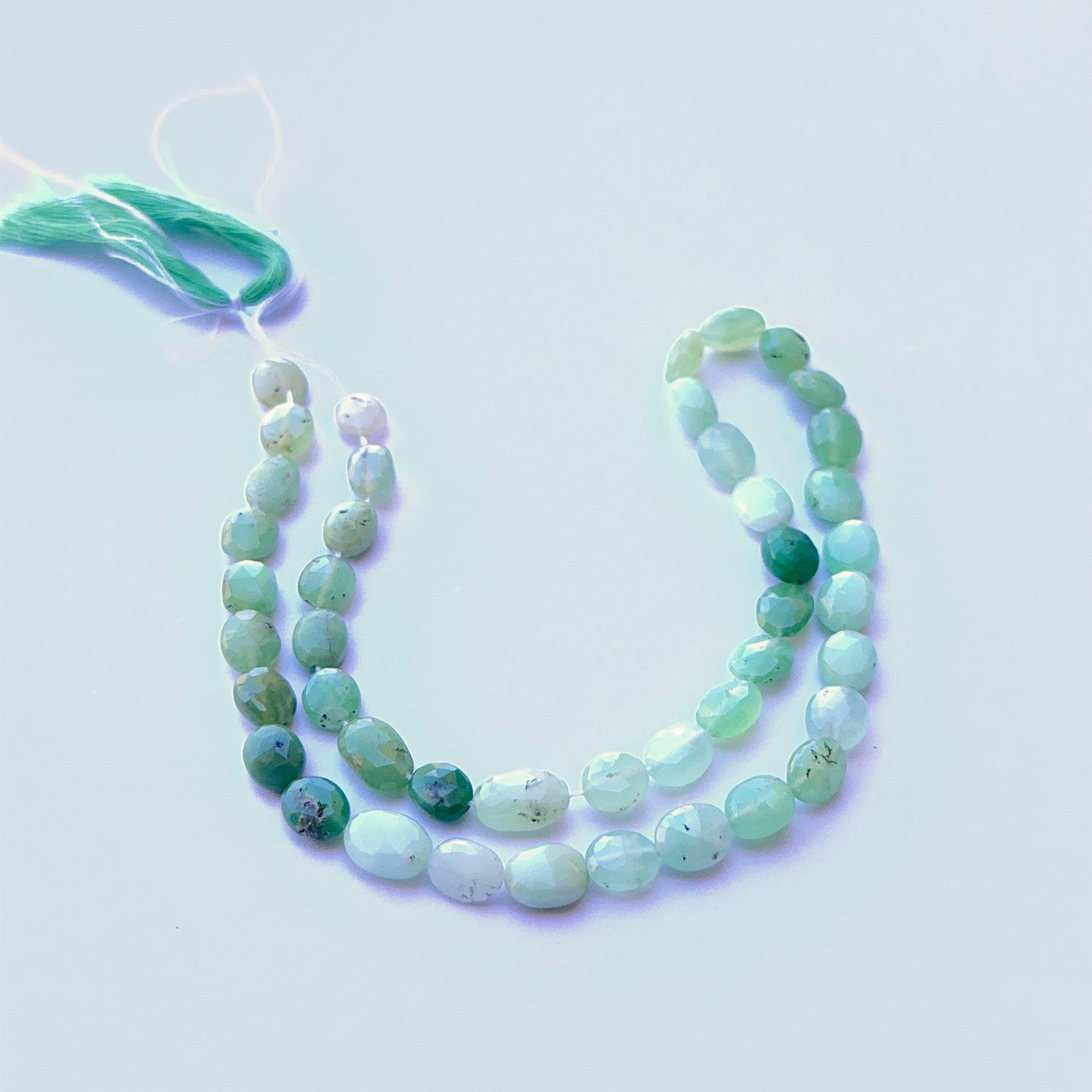 Detailed view of premium Chrysoprase stone beads showing consistent shape, bright colour and high‑quality faceting.