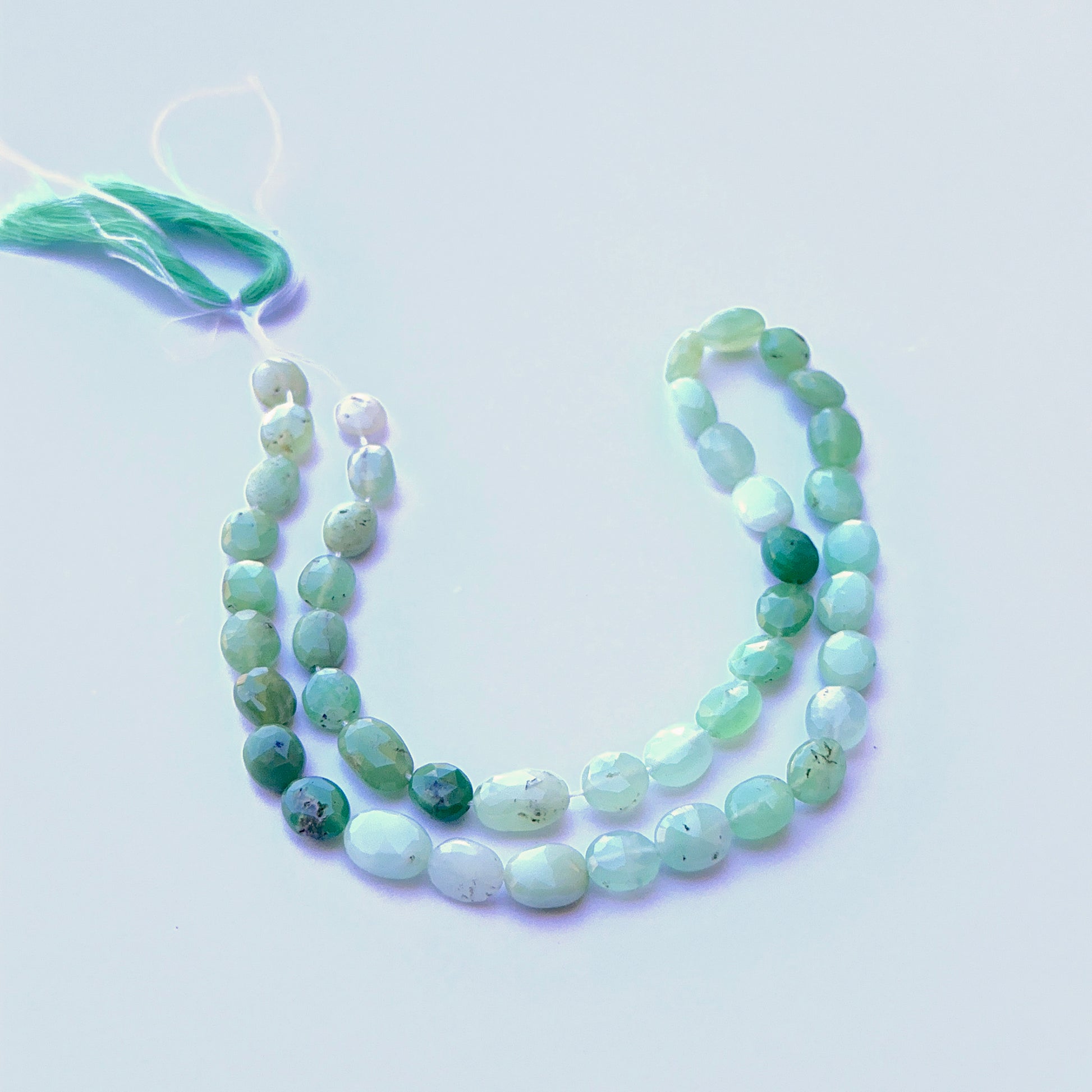 Detailed view of premium Chrysoprase stone beads showing consistent shape, bright colour and high‑quality faceting.