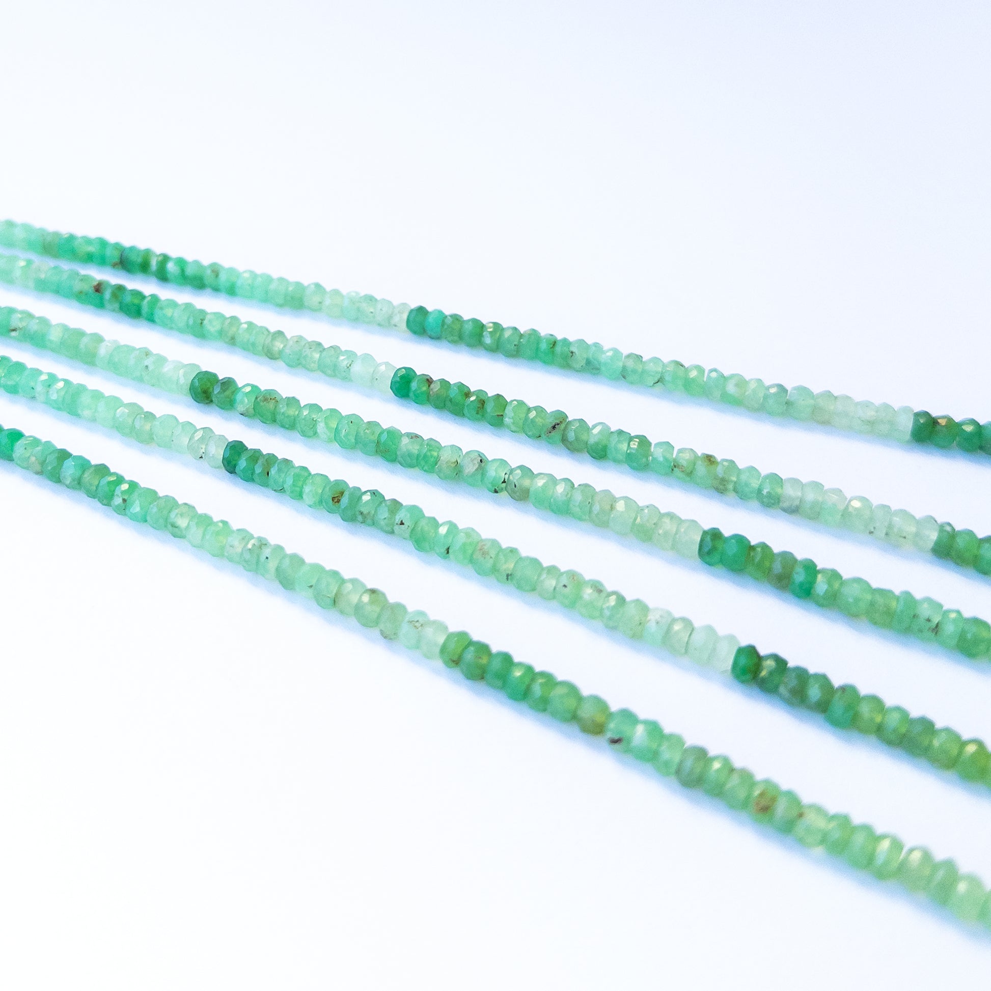 Chrysoprase faceted rondelle gemstone beads in 4.2–4.4mm size arranged on a 34cm strand for handmade jewellery designs.