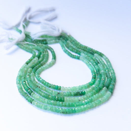 Handmade jewellery components featuring natural chrysoprase faceted rondelle beads in a neatly aligned strand.