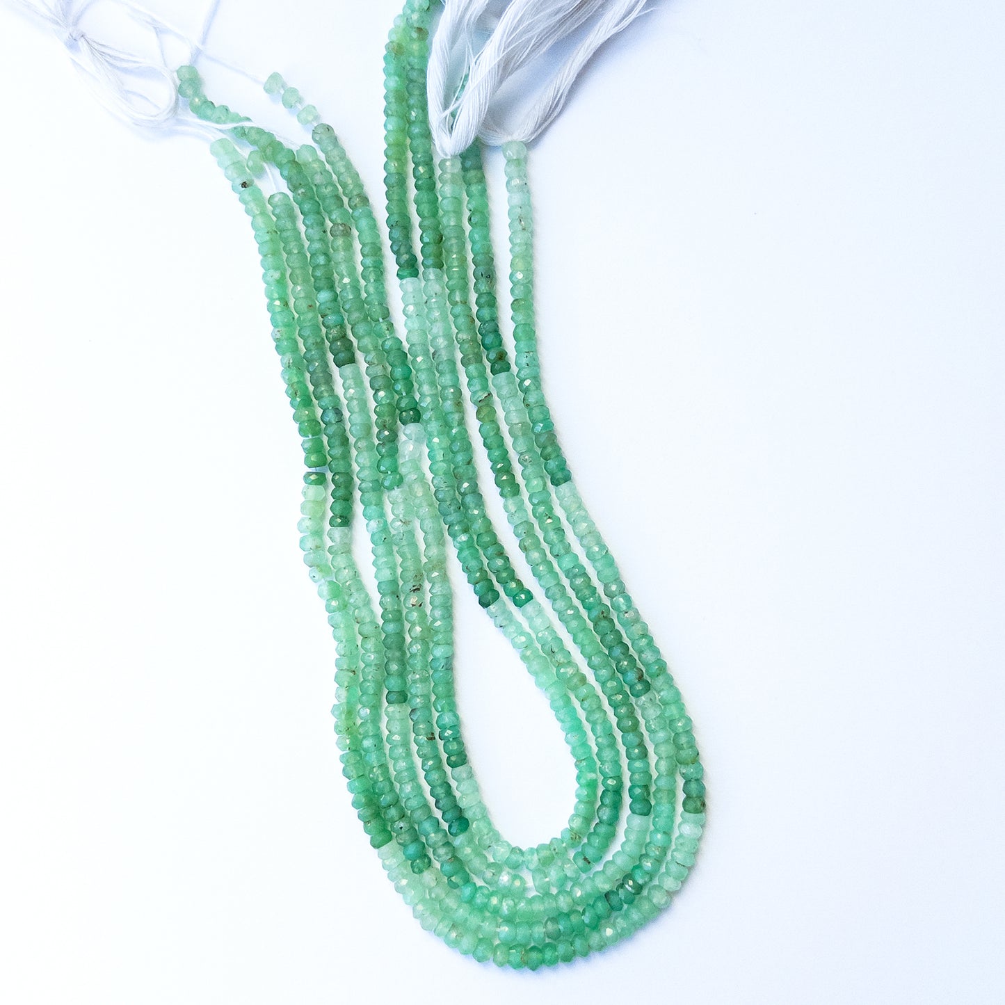 Genuine chrysoprase stone beads with sparkling faceted rondelle shaping, ideal for DIY jewellery and artisan beadwork.