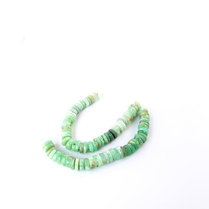 Premium Chrysoprase wheel beads showcasing polished surfaces and natural apple‑green colour.