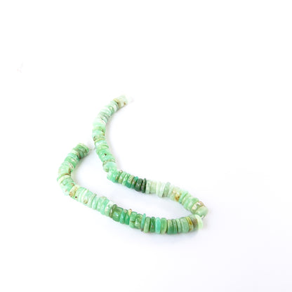 Close‑up of smooth wheel Chrysoprase beads with glossy finish, perfect for authentic gemstone bead jewellery.