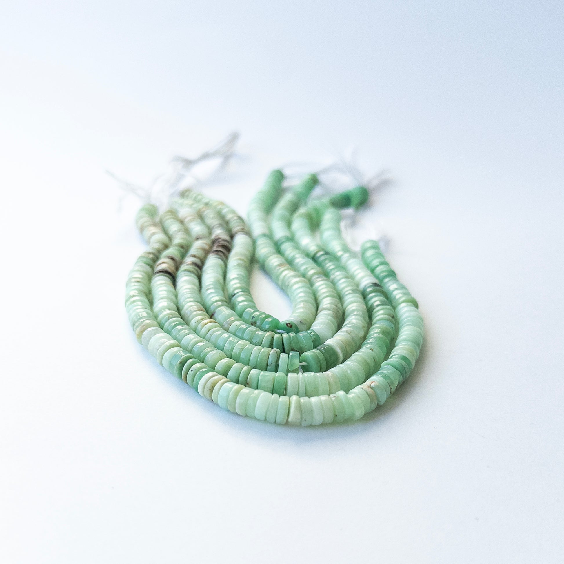 Chrysoprase smooth wheel beads in 5.9–6mm, showcasing fresh green tones for genuine gemstone beads and handmade jewellery components.
