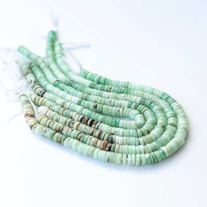 Chrysoprase smooth wheel beads with natural variation, perfect for handmade jewellery components and creative beadwork.