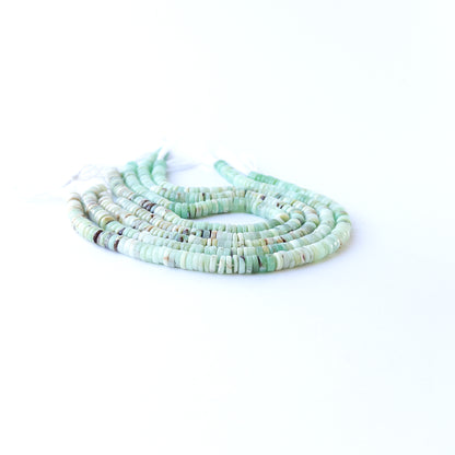 Chrysoprase wheel beads showcasing natural shine and elegant rounded shape for gemstone bead creators.