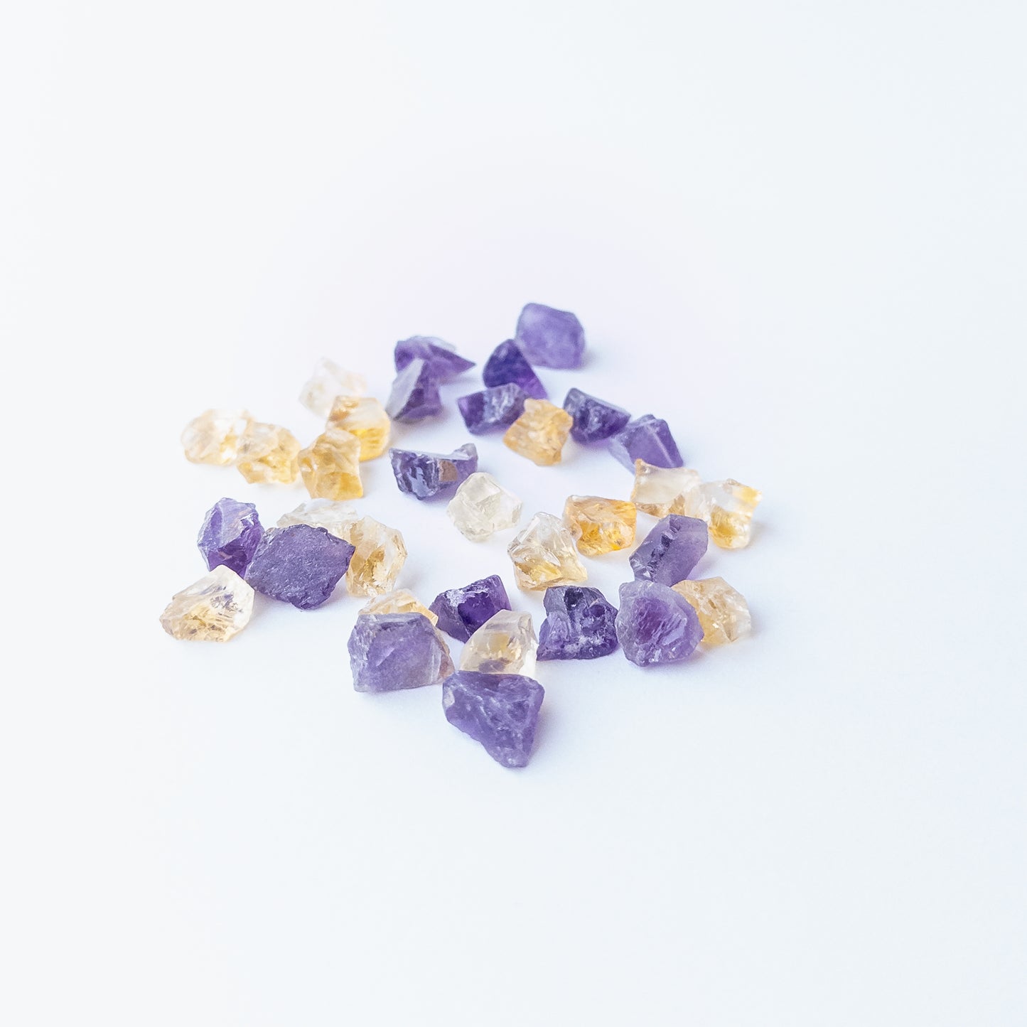Authentic Citrine and Amethyst undrilled rough stones showcasing bright yellow and purple tones.