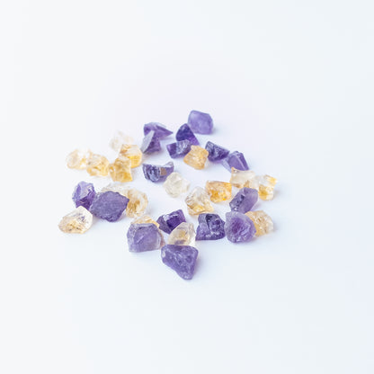 Authentic Citrine and Amethyst undrilled rough stones showcasing bright yellow and purple tones.