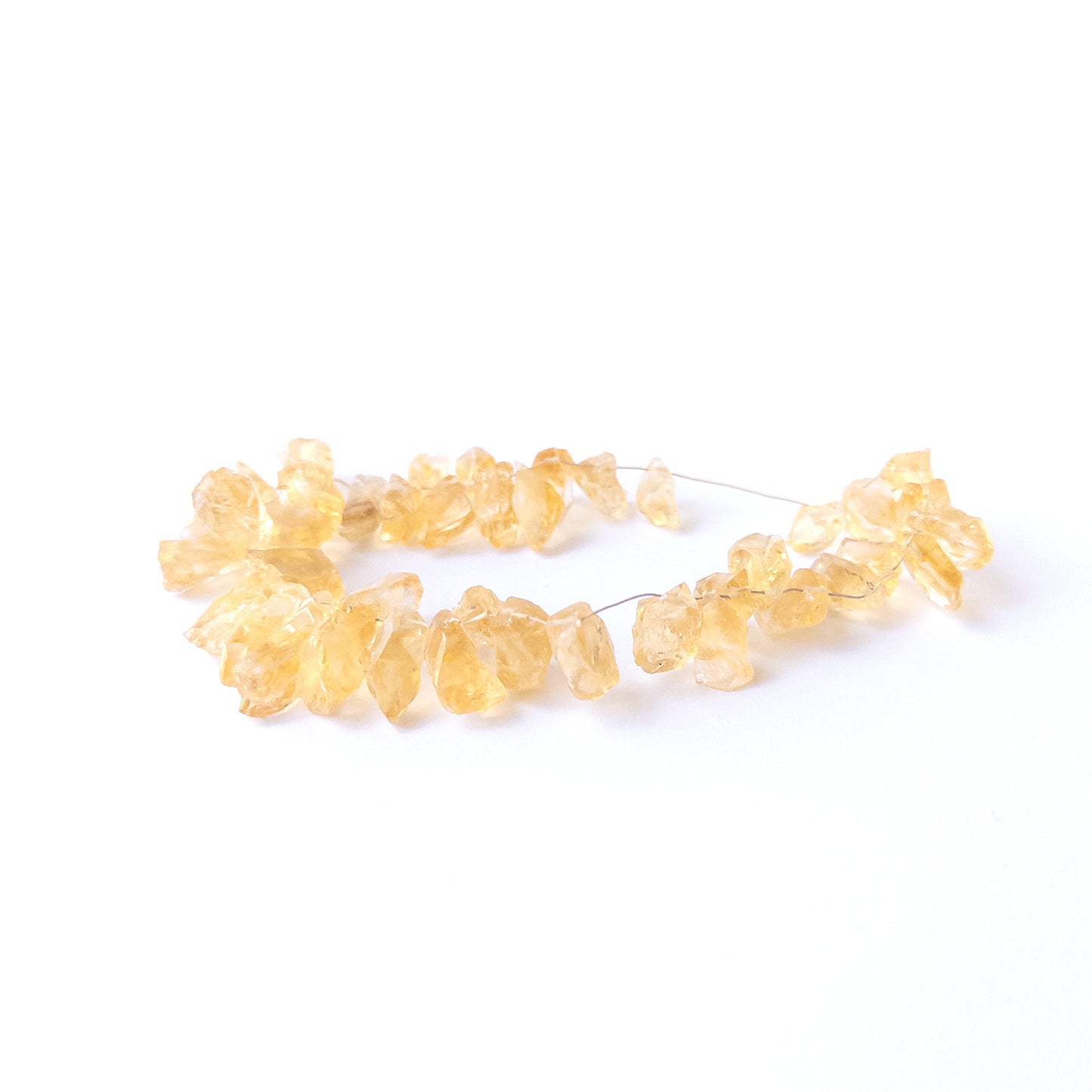 Citrine drilled rough beads with natural sparkle and earthy texture, perfect for authentic gemstone bead designs.