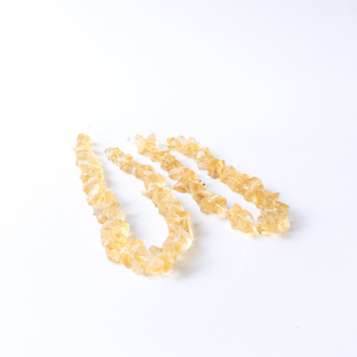 High‑quality Citrine gemstone beads with natural rough surfaces and vibrant golden colour.