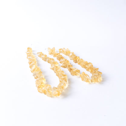 High‑quality Citrine gemstone beads with natural rough surfaces and vibrant golden colour.