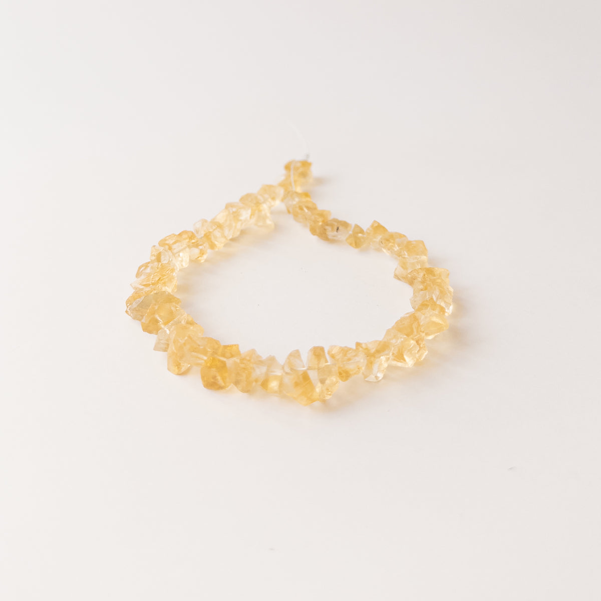 Authentic Citrine rough gemstone beads displaying warm yellow tones and organic uncut texture.
