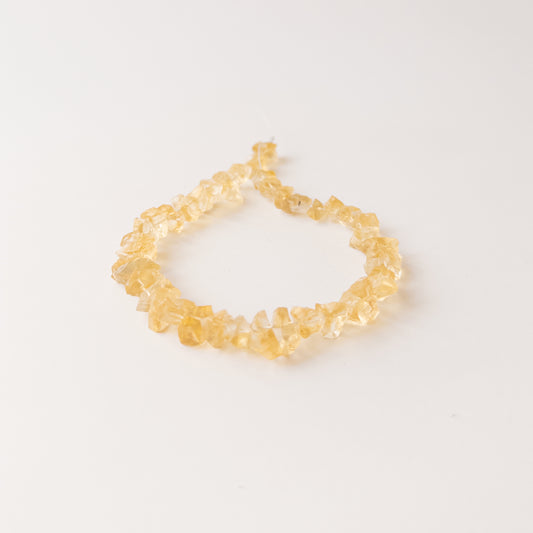 Authentic Citrine rough gemstone beads displaying warm yellow tones and organic uncut texture.