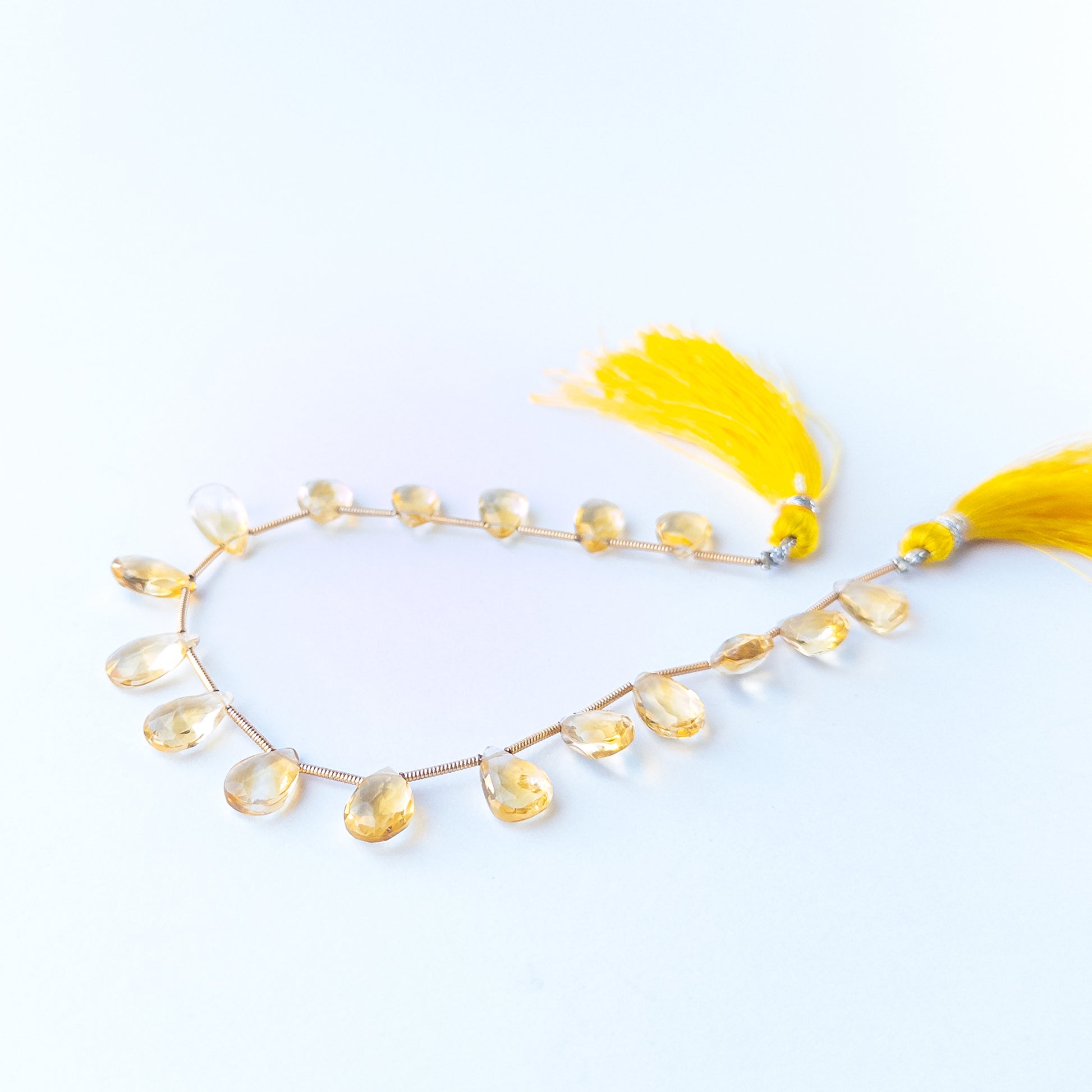 High‑quality Citrine faceted briolette beads in 7–7.5mm size offering brilliance and shine for artisan jewellery projects.