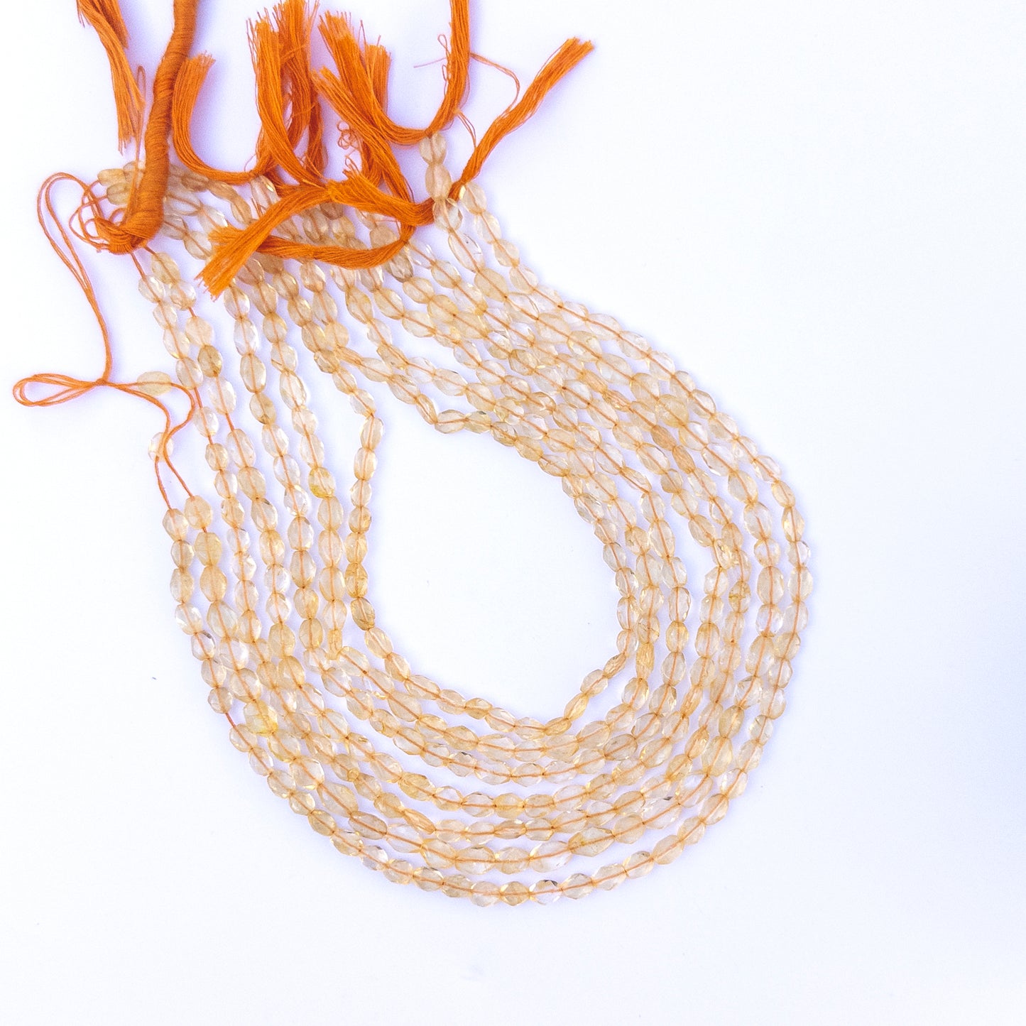Detailed view of citrine oval beads with crisp faceting and natural golden glow for handmade jewellery components.