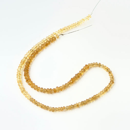 Citrine faceted rondelle stone beads showing warm golden colour and sparkle, ideal for genuine gemstone beads in DIY jewellery.