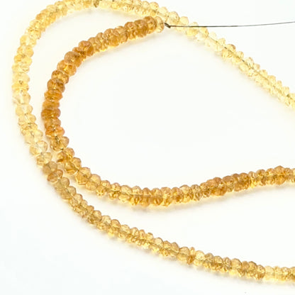 Close view of Citrine faceted rondelle stone beads showing cut, brilliance and polished finish for DIY jewellery makers.