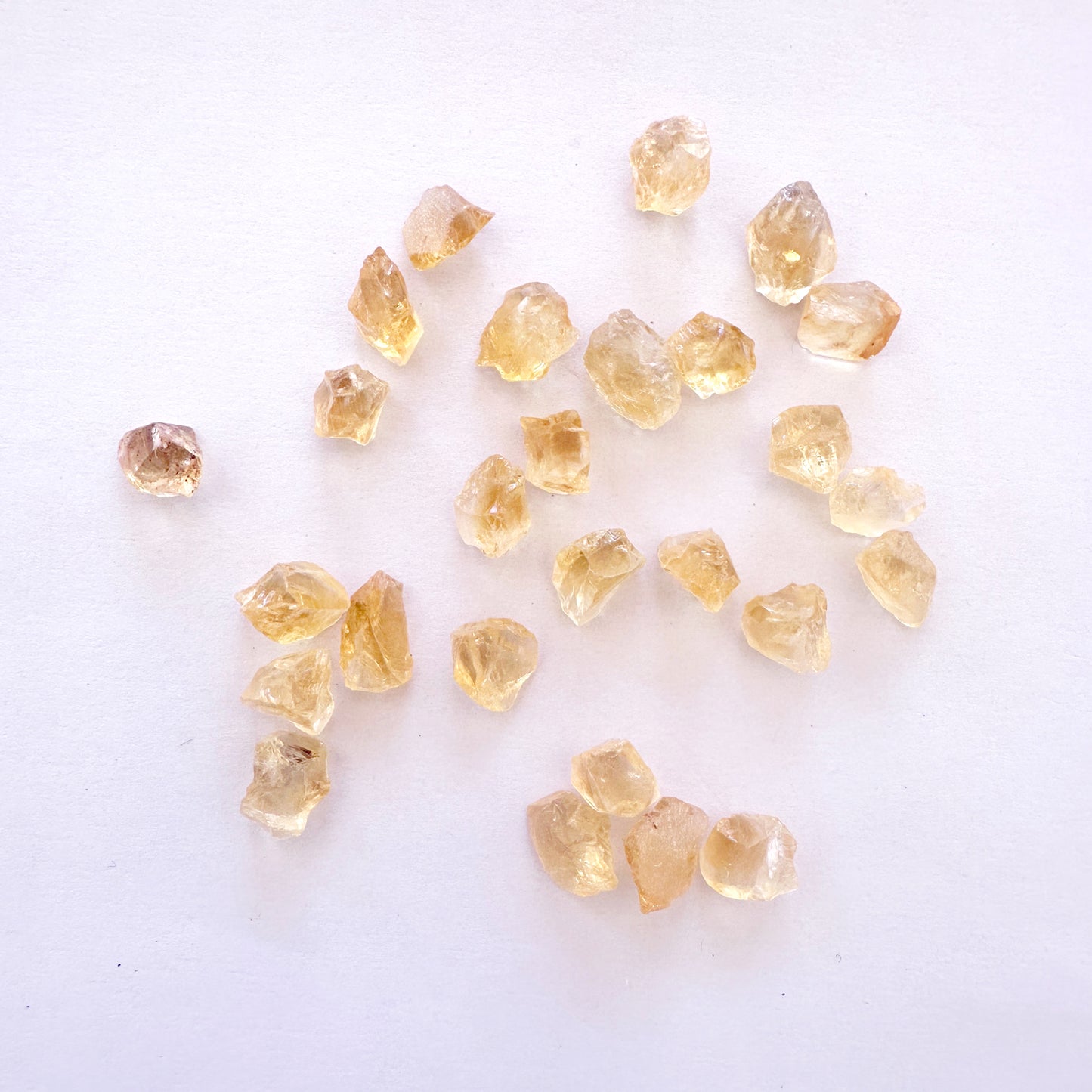 Loose rough Citrine gemstones with golden-yellow tones and natural texture in 7-8.5mm size.