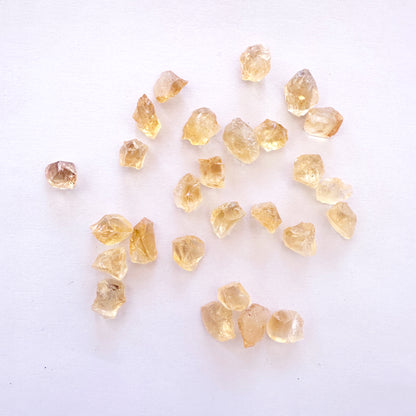 Loose rough Citrine gemstones with golden-yellow tones and natural texture in 7-8.5mm size.