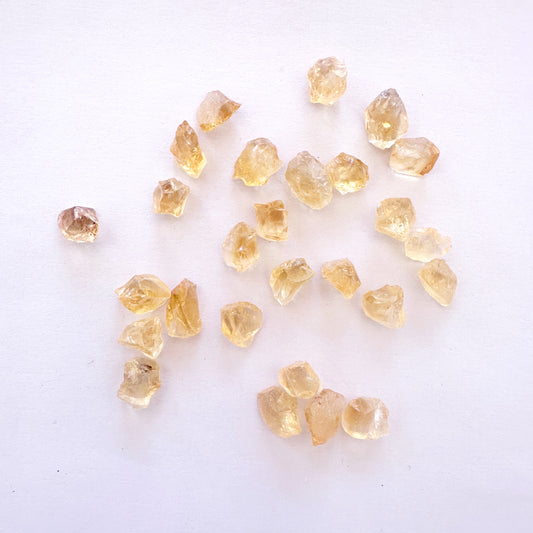 Loose rough Citrine gemstones with golden-yellow tones and natural texture in 7-8.5mm size.