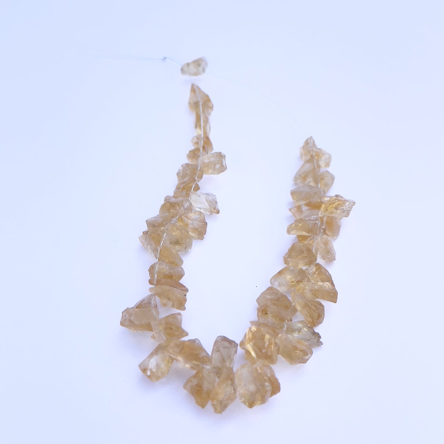 Natural gemstone beads for DIY jewellery showcasing drilled Citrine in rough cut. 