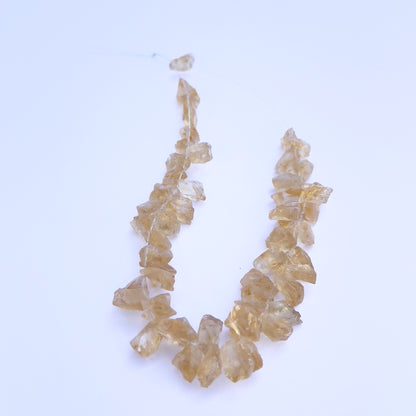Natural gemstone beads for DIY jewellery showcasing drilled Citrine in rough cut. 