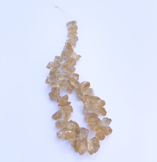 Drilled rough Citrine beads in 7–8mm size with golden hues and natural sparkle.