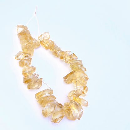 Close-up of natural gemstone beads highlighting rough cut and earthy character. 