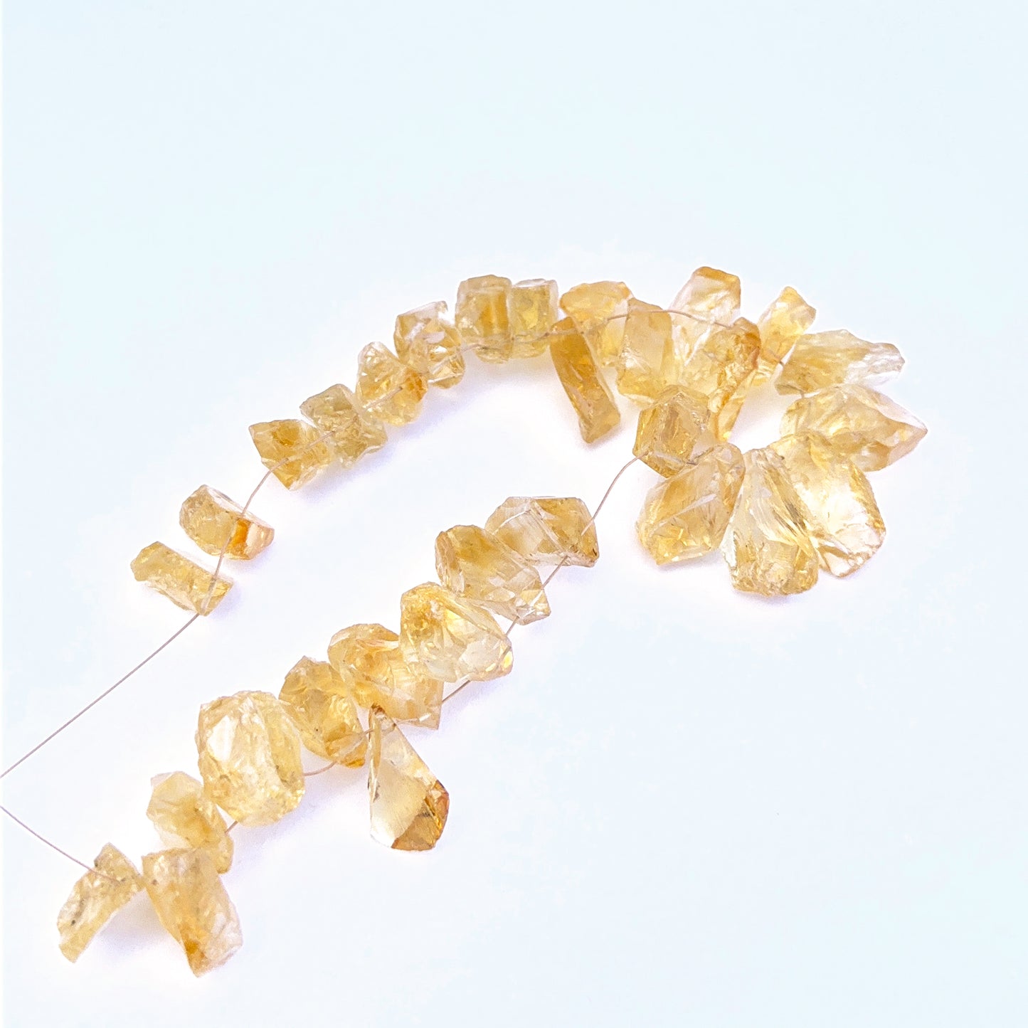 Handmade jewellery components featuring citrine rough beads in 9–12mm sizing.